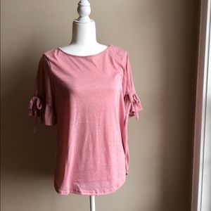 Pink top with ruffled tie detail sleeves